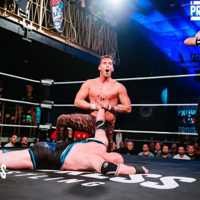 Tate Mayfairs wristlocks Simon Miller at PROGRESS Wrestling